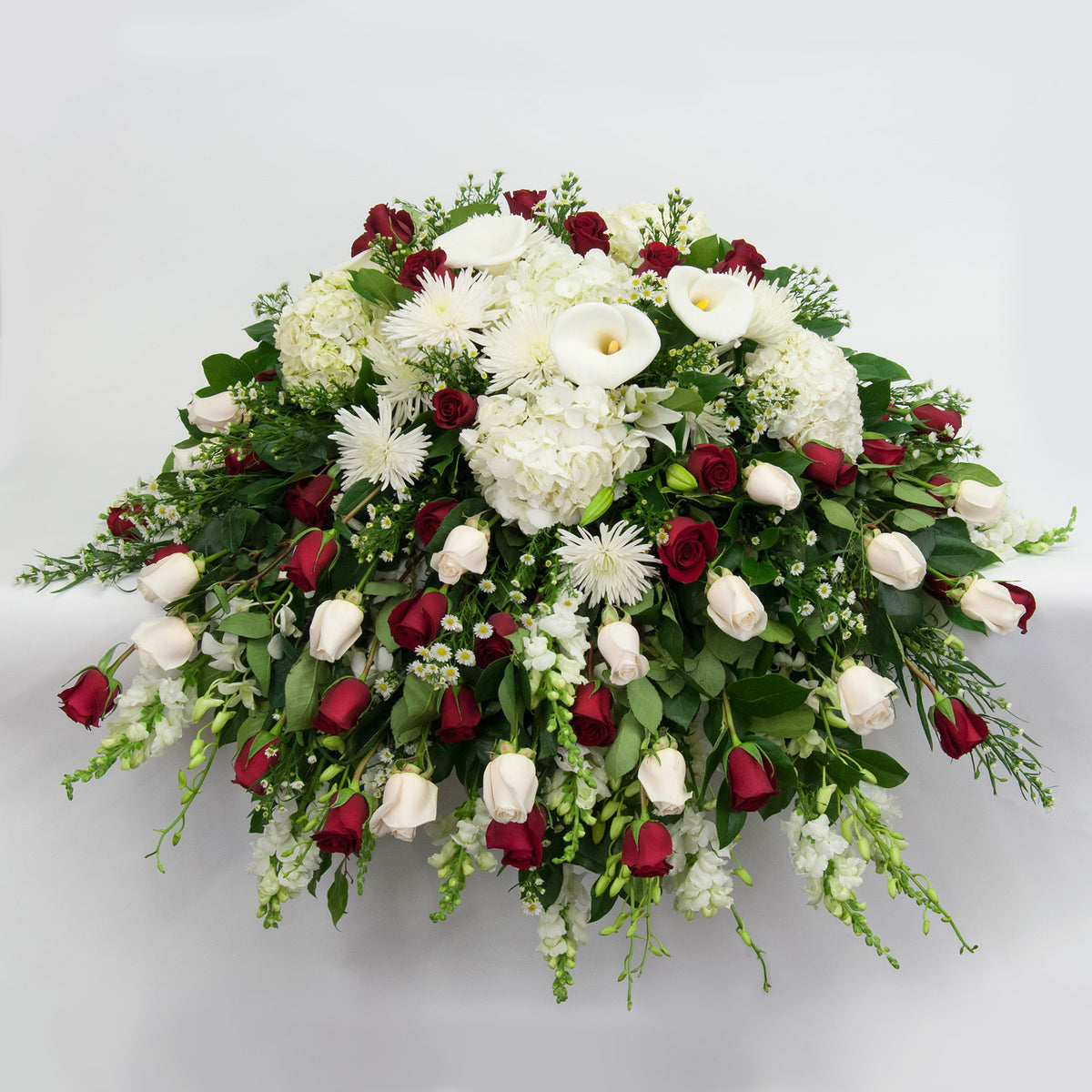 red rose and white lily casket spray White and Red Rose Casket Spray – Brattle Square Florist